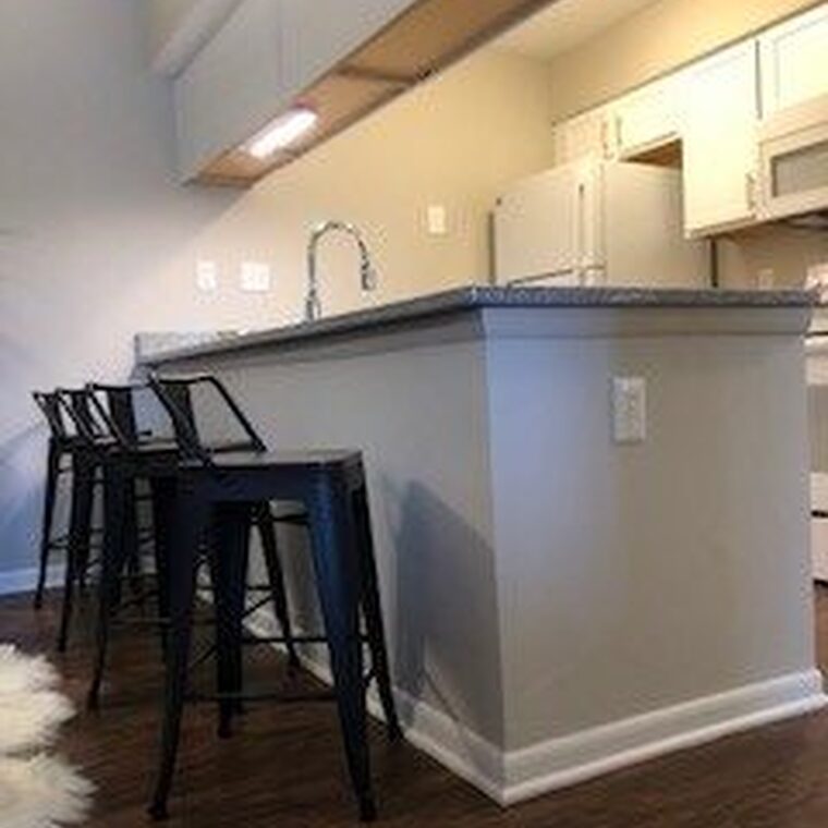 Kitchen with island bar seating