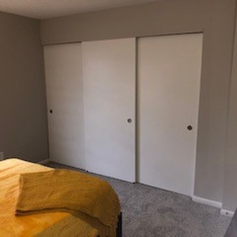 Bedroom with attached closet