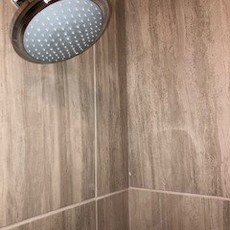 Shower head and modern shower tiling